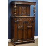 Medium oak court cupboard, with raised cupboard above drawer and panelled double cupboard,