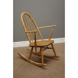 Ercol 'Windsor' light elm and beech rocking chair and an Ercol wall hanging plate rack