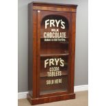 Victorian mahogany bookcase enclosed by arched glazed door,