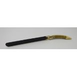 Late Victorian boar tusk and ebony page turner with silver mounts by William Comyns & Sons, 1894,