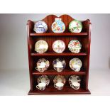 Set of twelve Royal Worcester miniature cabinet cups and saucers, retailed by Compton & Woodhouse,