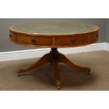 Reproduction yew wood circular drum table, inset leather top, four drawer,