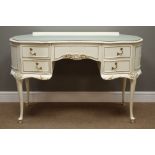 Late 20th century cream and gilt serpentine dressing table with five drawers, W124cm, H78cm,