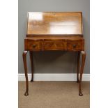 Early 20th century walnut fall front writing desk, leather inset with fitted interior,