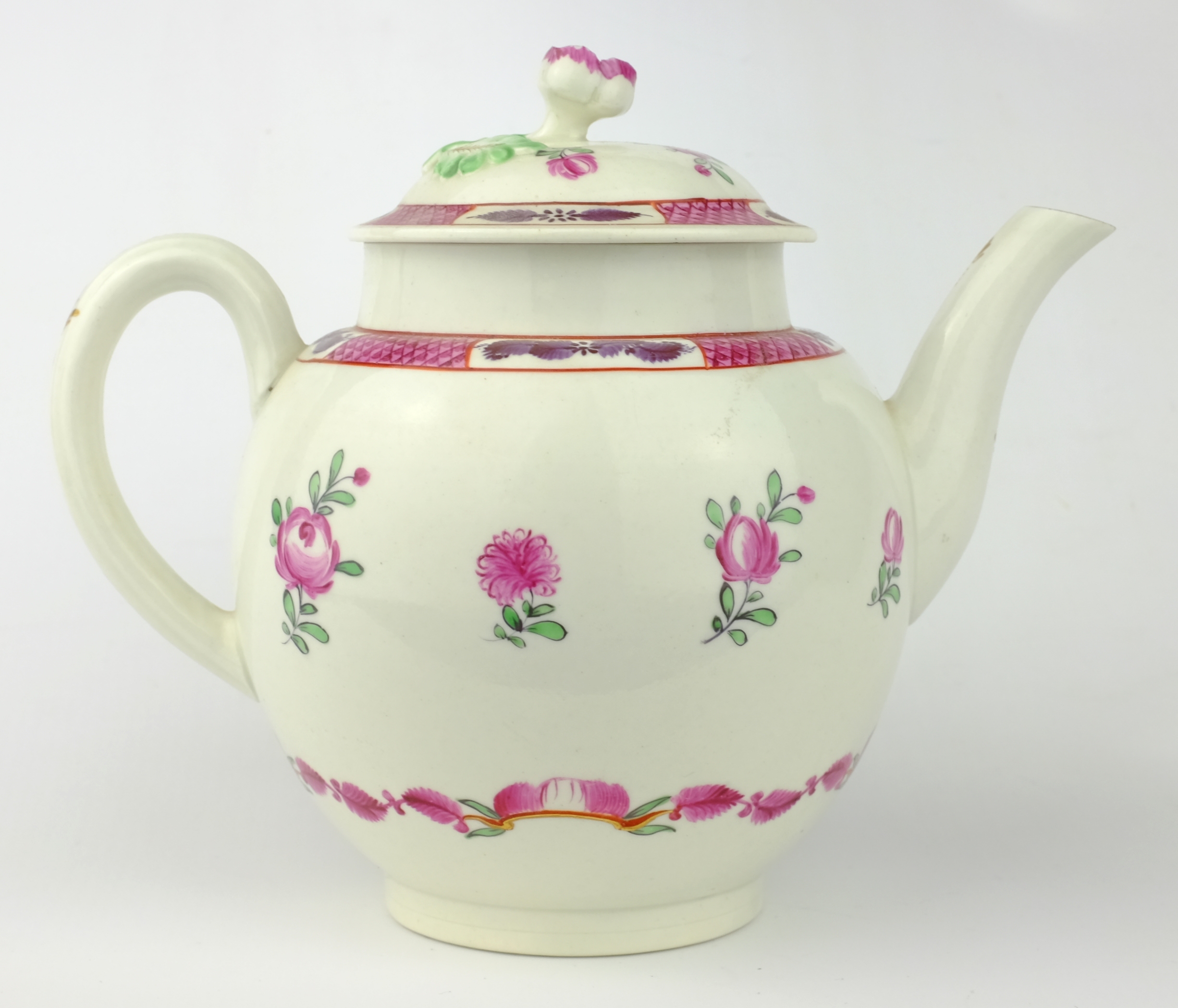 Late 18th century globular teapot, painted with floral sprays below a fish scale border,