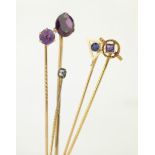 Four 14ct gold stick pins set with sapphire,
