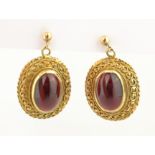 Pair of cabochon garnet gold mounted pendant ear-rings stamped 9ct approx 7.