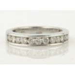 White gold channel set round brilliant cut diamond half eternity ring stamped 14K