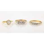 Three stone diamond ring stamped 18ct & PLAT,