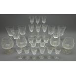 Waterford 'Lismore' drinking glasses comprising; six red wine, four brandy, six small wine glasses,