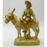 Early 20th Century Royal Dux figure of a young boy on a donkey, impressed and applied marks to base,