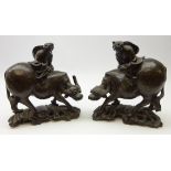Pair 19th century Chinese root wood carvings depicting figures astride water buffalo with white