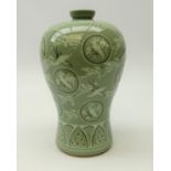 20th century Korean Celadon vase decorated with flying cranes in rondels amidst clouds,