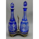 Pair of matched 19th/ early 20th century Bohemian blue overlay decanters each with faceted & cut