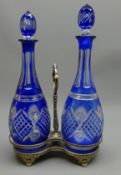 Pair of matched 19th/ early 20th century Bohemian blue overlay decanters each with faceted & cut