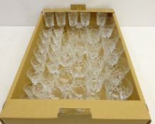 Matched suite of crystal drinking glasses comprising; five champagne flutes, nine red wine goblets,