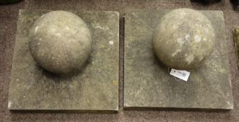 Pair stone effect spherical gate post finials on square mounts,