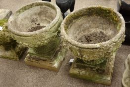 Pair stone effect circular planters, moulded with fruit decoration,