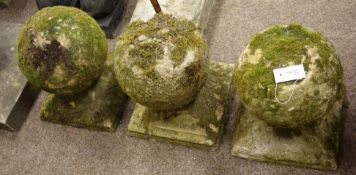 Three 18th/19th century weathered sandstone spherical gate post finials,