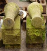 Weathered stone cannon ornaments on rough cut plinths H50cm Condition Report <a