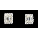 Pair of platinum emerald cut and round brilliant cut diamond stud ear-rings with WGI certificate
