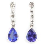 Pair of white gold pear shape tanzanite, round and baguette diamond pendant ear-rings