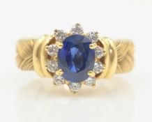 Sapphire and brilliant cut diamond cluster ring,
