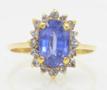 Tanzanite and diamond cluster ring stamped 18ct Condition Report size Q<a