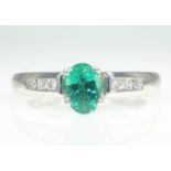 18ct white gold oval emerald and channel set diamond ring hallmarked - emerald approx 1 carat