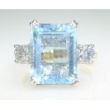 Emerald cut aquamarine and diamond three stone ring white gold ring hallmarked 18ct