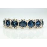 White gold seven stone sapphire ring stamped 18ct Condition Report Approx 4.