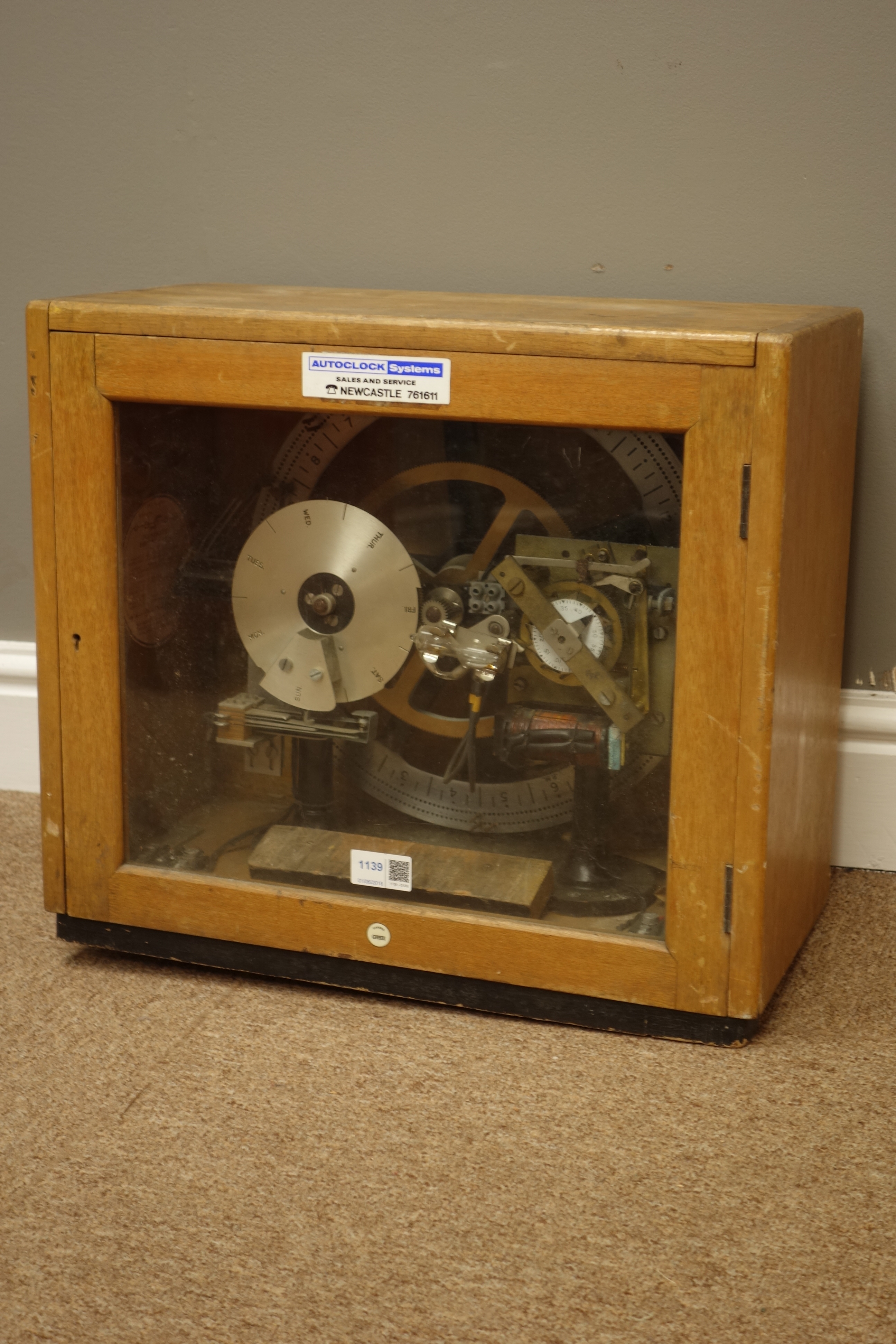 Gents' of Leicester Pul-Syn-Etic Impulse factory time clock with silvered Day & Time dials,