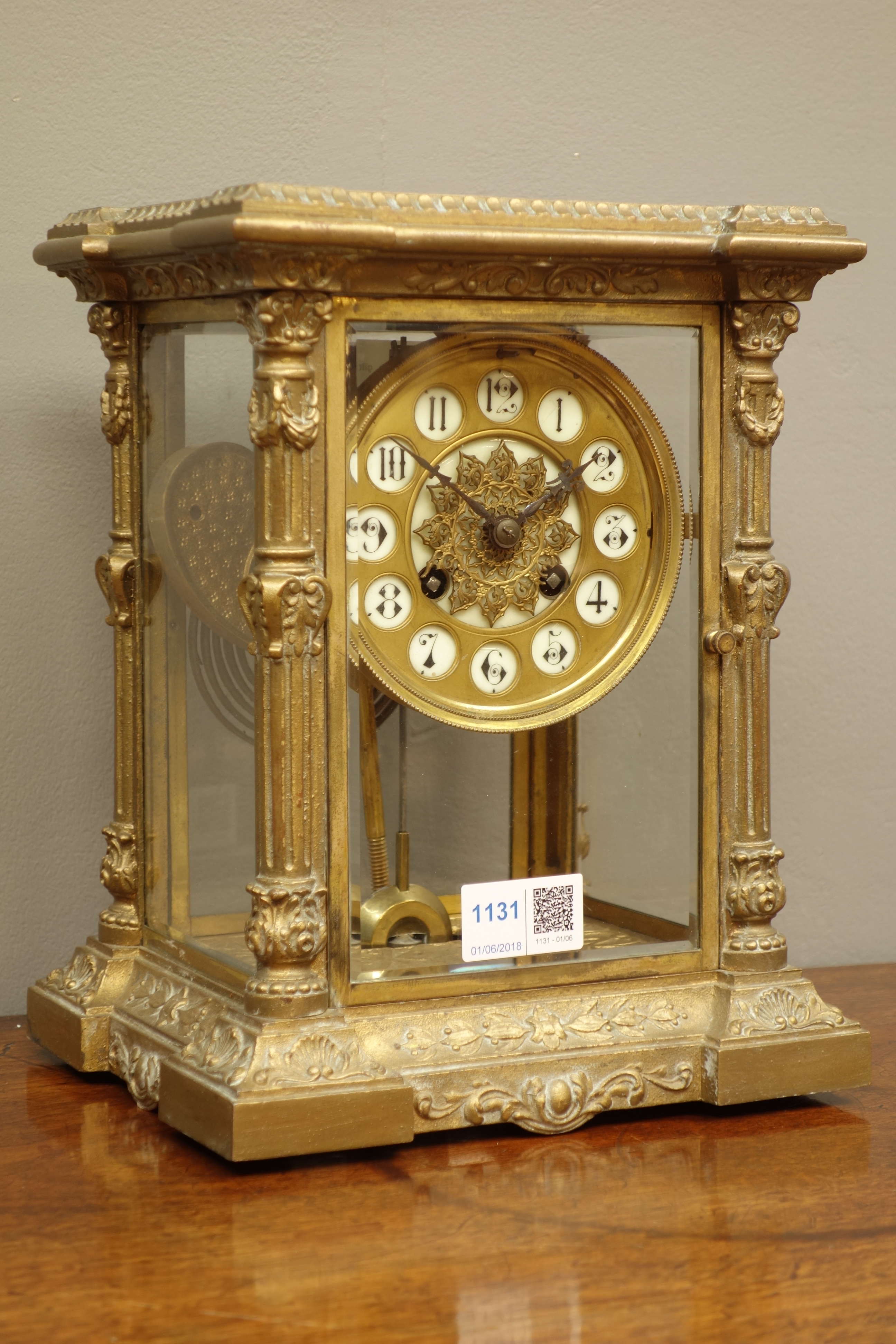 Late 19th century French gilt metal four glass mantel clock, circular dial with inset numerals,