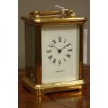 Mapin & Webb brass carriage timepiece, signed Roman dial, with eleven jewel movement,