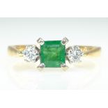 Emerald and diamond three stone gold ring hallmarked 18ct Condition Report Approx 2.
