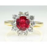 18ct gold ruby and diamond cluster ring hallmarked,