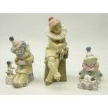 Three Lladro figures, 'Clown with Concertina' No. 5279, 'Clown with Puppy' No.