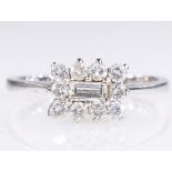 18ct white gold diamond and baguette diamond cluster ring hallmarked approx 0.