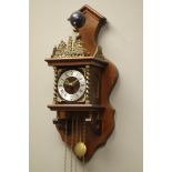 Dutch wall clock with pierced brass cresting on column supports,