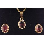 Gold garnet pendant necklace and pair ear-rings ensuite stamped 9ct Condition Report