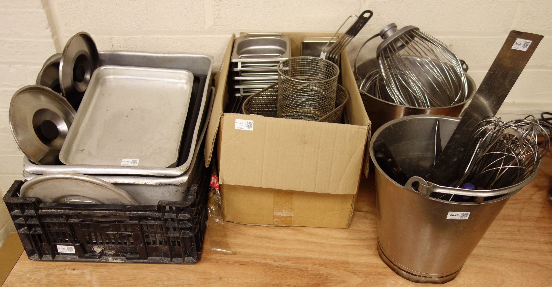 Two stainless steel buckets, kitchen knives, basket fryers, baking trays etc...