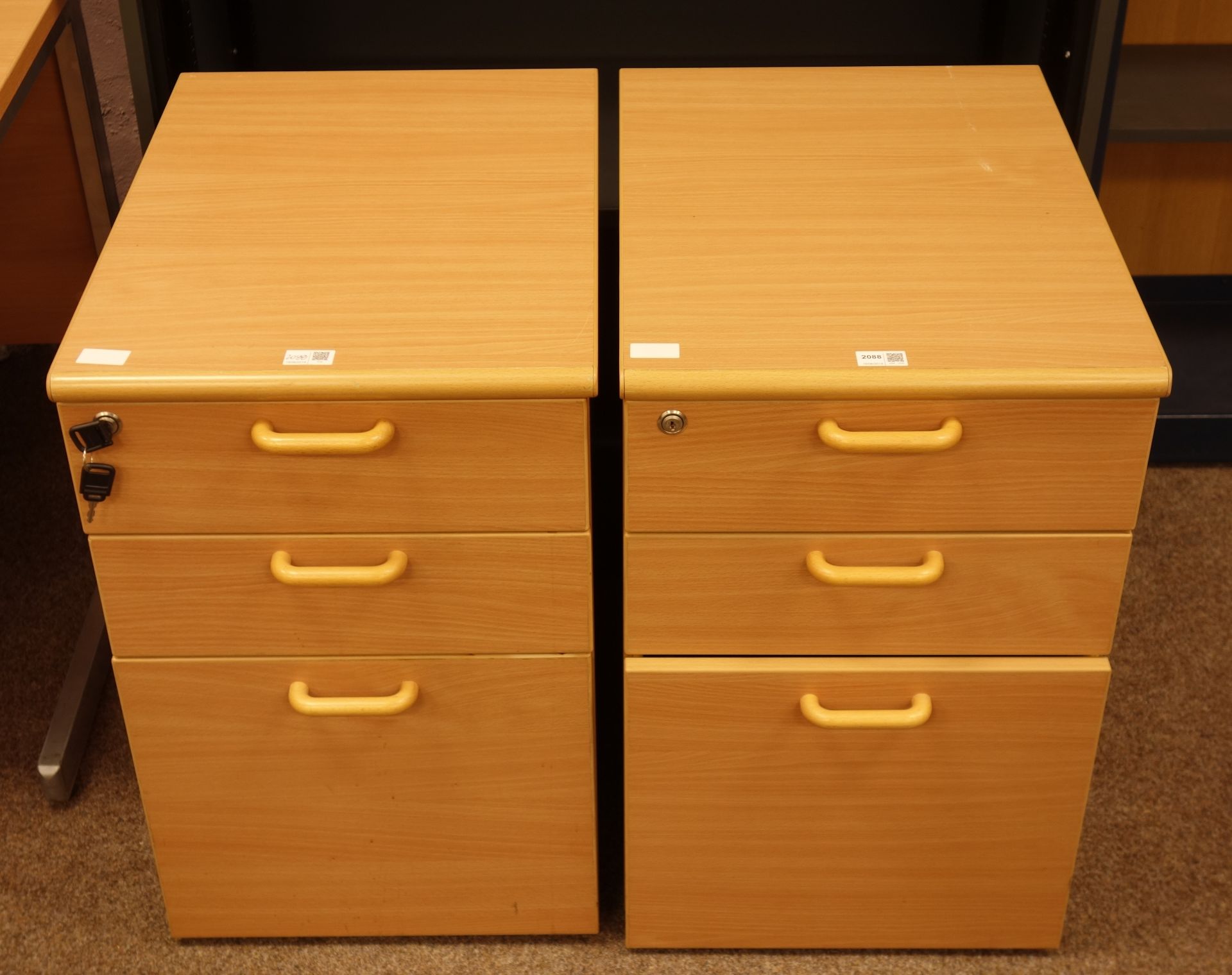 Light beech finish three drawer office pedestal filing cabinets, with wooden handles, W42cm, H66cm,