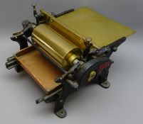 Early 20th century cast iron Prakma manual poster Gluing machine with copper tray,