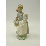 Lladro figure of a lady with flower basket holding a lamb,