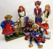 Five hand crafted composite dolls designed by Margaret Hickson; Dutch couple mounted on stand,