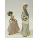 Two Lladro figurines; Seated lady with lilies, H24cm and 'Iris' No.