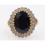 Oval sapphire and diamond cluster ring hallmarked 9ct Condition Report Approx 5.