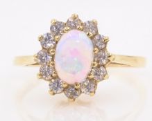 Opal and stone set gold ring hallmarked 9ct Condition Report approx 2gm size