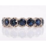 White gold seven stone sapphire ring stamped 18ct Condition Report Approx 4.