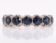 White gold seven stone sapphire ring stamped 18ct Condition Report Approx 4.